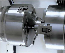The transfer of the workpiece between the spindles 